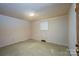 A simple room featuring neutral walls, linoleum floors, window, and closet at 2871 Loviee Rd, Lincolnton, NC 28092