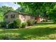 Brick home with shutters, landscaping, and a well-manicured lawn at 2871 Loviee Rd, Lincolnton, NC 28092
