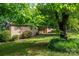 Brick home with shutters, landscaping, and a well-manicured lawn at 2871 Loviee Rd, Lincolnton, NC 28092