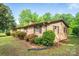 Brick home with manicured shrubs and an expansive lawn at 2871 Loviee Rd, Lincolnton, NC 28092