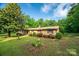 Charming brick home featuring well-maintained landscaping and a lush green lawn at 2871 Loviee Rd, Lincolnton, NC 28092