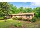 Charming brick home featuring well-maintained landscaping and a lush green lawn at 2871 Loviee Rd, Lincolnton, NC 28092