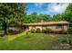 Charming brick home with shutters, landscaping, and a well-manicured lawn at 2871 Loviee Rd, Lincolnton, NC 28092