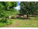 A quaint home with a lush green lawn and mature shade trees at 2871 Loviee Rd, Lincolnton, NC 28092