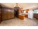 Cozy kitchen features wood paneling, an island bar, and lots of cabinet space at 2871 Loviee Rd, Lincolnton, NC 28092
