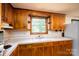 Kitchen features wooden cabinetry and a window above the sink offering outdoor views at 2871 Loviee Rd, Lincolnton, NC 28092
