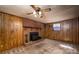 The living room features a brick fireplace and wooden paneling at 2871 Loviee Rd, Lincolnton, NC 28092