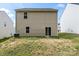 Back exterior of home with a sliding glass door and a lawn at 2922 Patishall Ln, Charlotte, NC 28214