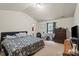 Bright primary bedroom with a large bed and neutral walls at 2922 Patishall Ln, Charlotte, NC 28214