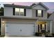 Beautiful two-story home with well-kept landscaping and a two-car garage at 2922 Patishall Ln, Charlotte, NC 28214