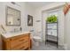 Clean bathroom offering a wood vanity and medicine cabinet, with bright natural light at 3005 Vernell Ln, Shelby, NC 28150