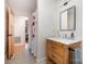 Bright bathroom features a wood vanity with marble countertop and chrome hardware at 3005 Vernell Ln, Shelby, NC 28150