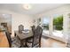Bright dining room featuring a table with chairs, adjacent to the kitchen at 3005 Vernell Ln, Shelby, NC 28150