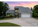 Charming two-story home with a two-car garage and mature landscaping at 3005 Vernell Ln, Shelby, NC 28150