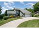 Charming two-story home with attached garage, lovely landscaping and long driveway at 3005 Vernell Ln, Shelby, NC 28150