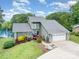 Inviting waterfront home featuring lush landscaping and serene water views at 3005 Vernell Ln, Shelby, NC 28150