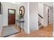 Welcoming foyer featuring hardwood floors, a decorative mirror, and a staircase at 3005 Vernell Ln, Shelby, NC 28150