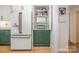 Bright kitchen pantry featuring custom cabinets and modern refrigerator at 3005 Vernell Ln, Shelby, NC 28150