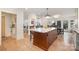Bright kitchen featuring a large island with seating, adjacent to the dining room at 3005 Vernell Ln, Shelby, NC 28150