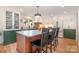 Bright kitchen featuring custom cabinets and a large island with seating at 3005 Vernell Ln, Shelby, NC 28150