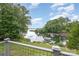 Breathtaking lake views from the fenced deck overlooking the lush green lawn and private boat dock at 3005 Vernell Ln, Shelby, NC 28150