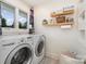 Convenient laundry room featuring a modern washer and dryer, plus ample storage at 3005 Vernell Ln, Shelby, NC 28150