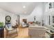 Bright living room boasts an open floor plan, large windows, and hardwood flooring at 3005 Vernell Ln, Shelby, NC 28150