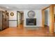An open living area with hardwood floors and a fireplace creating a cozy and inviting atmosphere at 3005 Vernell Ln, Shelby, NC 28150