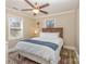 Cozy bedroom features a ceiling fan, natural light, and a stylish rug, creating a comfortable retreat at 3141 Mathis Dr, Charlotte, NC 28208