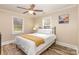 Bedroom featuring hardwood floors and natural light from two windows at 3141 Mathis Dr, Charlotte, NC 28208