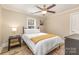 Cozy bedroom featuring a ceiling fan, and a bright window at 3141 Mathis Dr, Charlotte, NC 28208