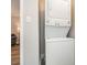 Modern laundry area featuring a stacked washer and dryer unit, offering convenience and space-saving design at 3141 Mathis Dr, Charlotte, NC 28208