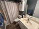 Neat bathroom featuring a shower-tub combo and updated vanity at 334 River Birch Cir, Mooresville, NC 28115