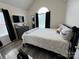 Comfortable bedroom featuring a vaulted ceiling and a large arched window at 334 River Birch Cir, Mooresville, NC 28115
