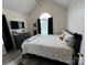 Comfortable bedroom featuring a vaulted ceiling and a large arched window at 334 River Birch Cir, Mooresville, NC 28115