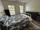 Well-lit bedroom with two bright windows and modern vinyl flooring at 334 River Birch Cir, Mooresville, NC 28115