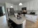 Modern kitchen featuring stainless steel appliances, granite countertops, and a central island at 334 River Birch Cir, Mooresville, NC 28115