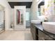 Modern bathroom with double sink, walk in shower and unique mirror at 3626 Cole Mill Rd, Charlotte, NC 28270