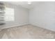 Neutral bedroom with carpet, window and accent wall at 3626 Cole Mill Rd, Charlotte, NC 28270