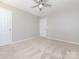 Bedroom featuring neutral walls, ceiling fan, and double door closet at 3626 Cole Mill Rd, Charlotte, NC 28270