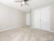 Neutral bedroom with carpet, a ceiling fan and double door closet at 3626 Cole Mill Rd, Charlotte, NC 28270