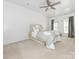 Bright bedroom with windows and a decorative bed at 3626 Cole Mill Rd, Charlotte, NC 28270