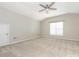 Bright, spacious bedroom with carpet floors, neutral paint, and ample natural light from a window at 3626 Cole Mill Rd, Charlotte, NC 28270