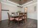 Elegant dining room featuring dark wood table and chairs with decorative ceiling at 3626 Cole Mill Rd, Charlotte, NC 28270