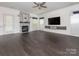 Spacious living room with a fireplace and modern design at 3626 Cole Mill Rd, Charlotte, NC 28270