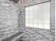 Beautiful tiled shower with shower bench and window at 3626 Cole Mill Rd, Charlotte, NC 28270