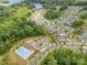 Aerial view of the neighborhood with a pool, playground, and lush green landscape at 4016 Spring Cove Way, Belmont, NC 28012
