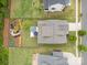 An aerial view shows the backyard patio, home and meticulously landscaped yard at 4016 Spring Cove Way, Belmont, NC 28012