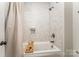 This bathroom features a soaking tub with a marble-tiled shower and a modern design at 4016 Spring Cove Way, Belmont, NC 28012