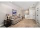 Comfortable bonus room with a neutral sofa, accent table and painting, perfect for relaxation at 4016 Spring Cove Way, Belmont, NC 28012